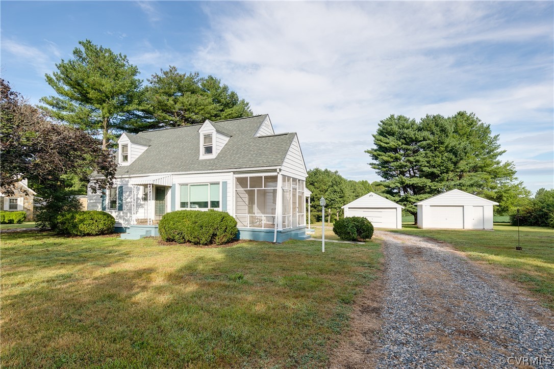 20404 Anderson Mill Road Beaverdam, VA 23015 - Photo 3 of 40 a front view of a house with a yard and garage