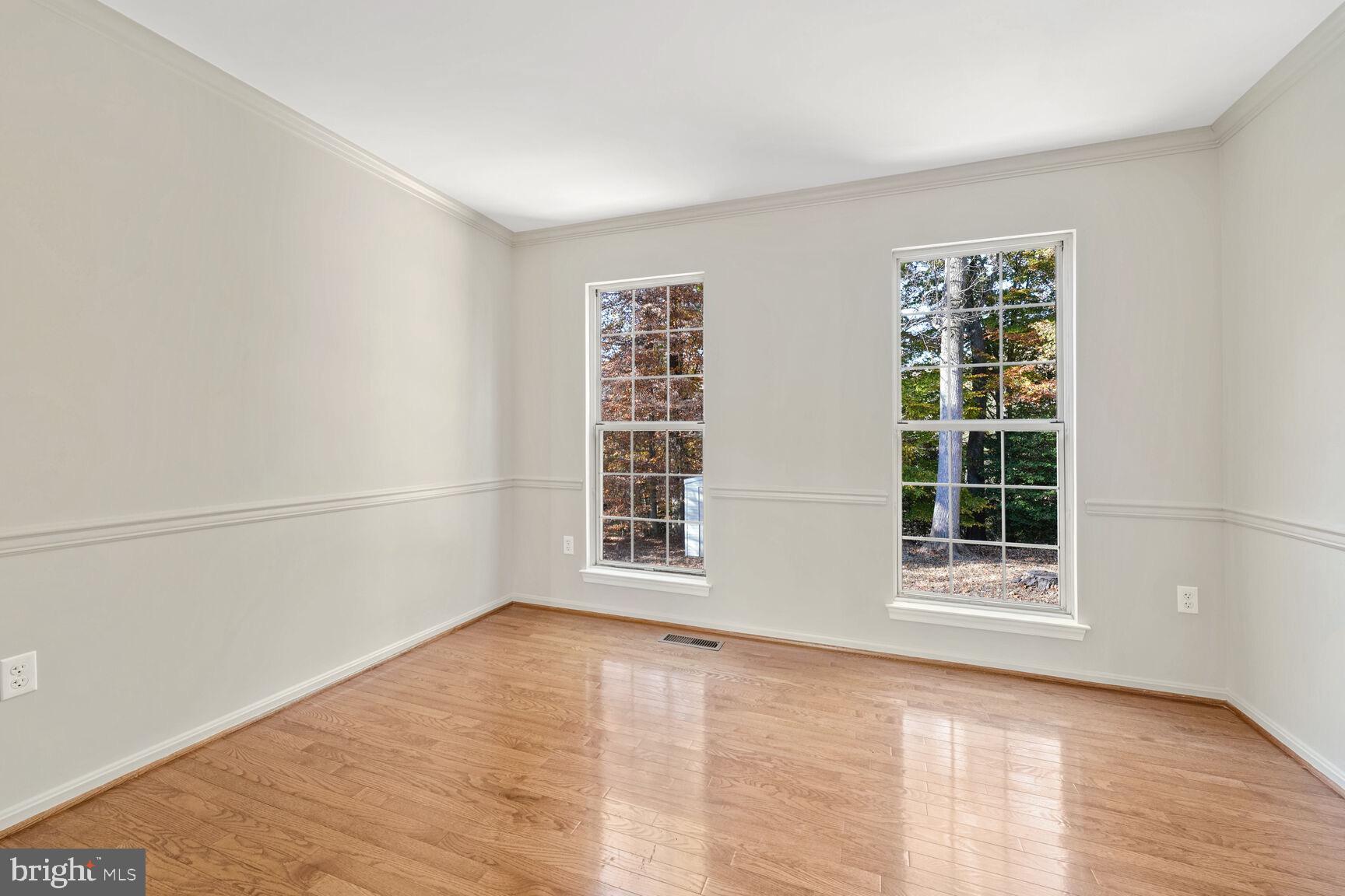 501 Dobbin Court Accokeek, MD 20607 - Photo 12 of 38 a view of an empty room with wooden floor and a window