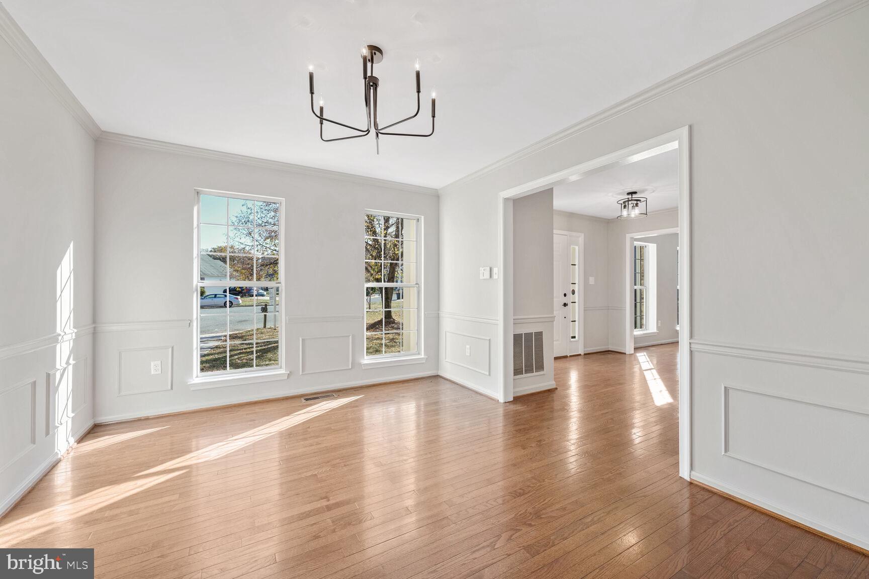 501 Dobbin Court Accokeek, MD 20607 - Photo 13 of 38 a view of an empty room with wooden floor and windows