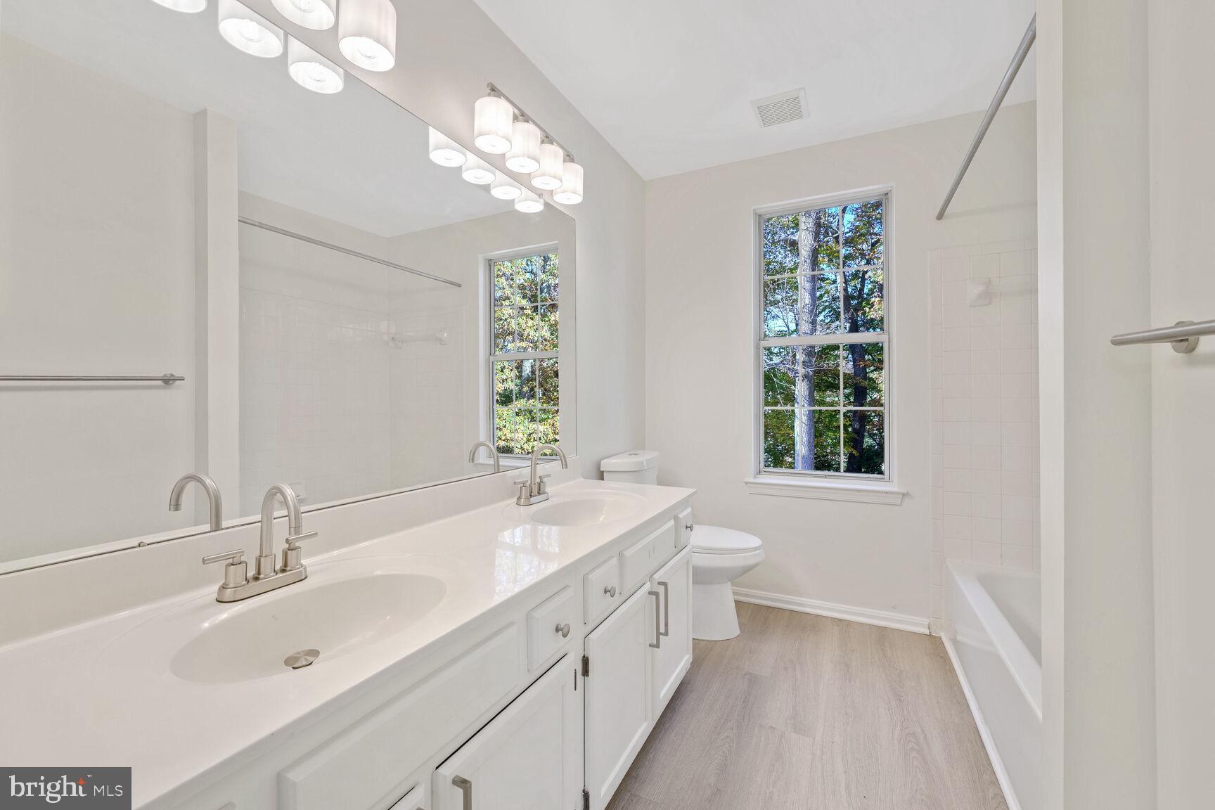 501 Dobbin Court Accokeek, MD 20607 - Photo 22 of 38 a bathroom with a sink a vanity and a bathtub