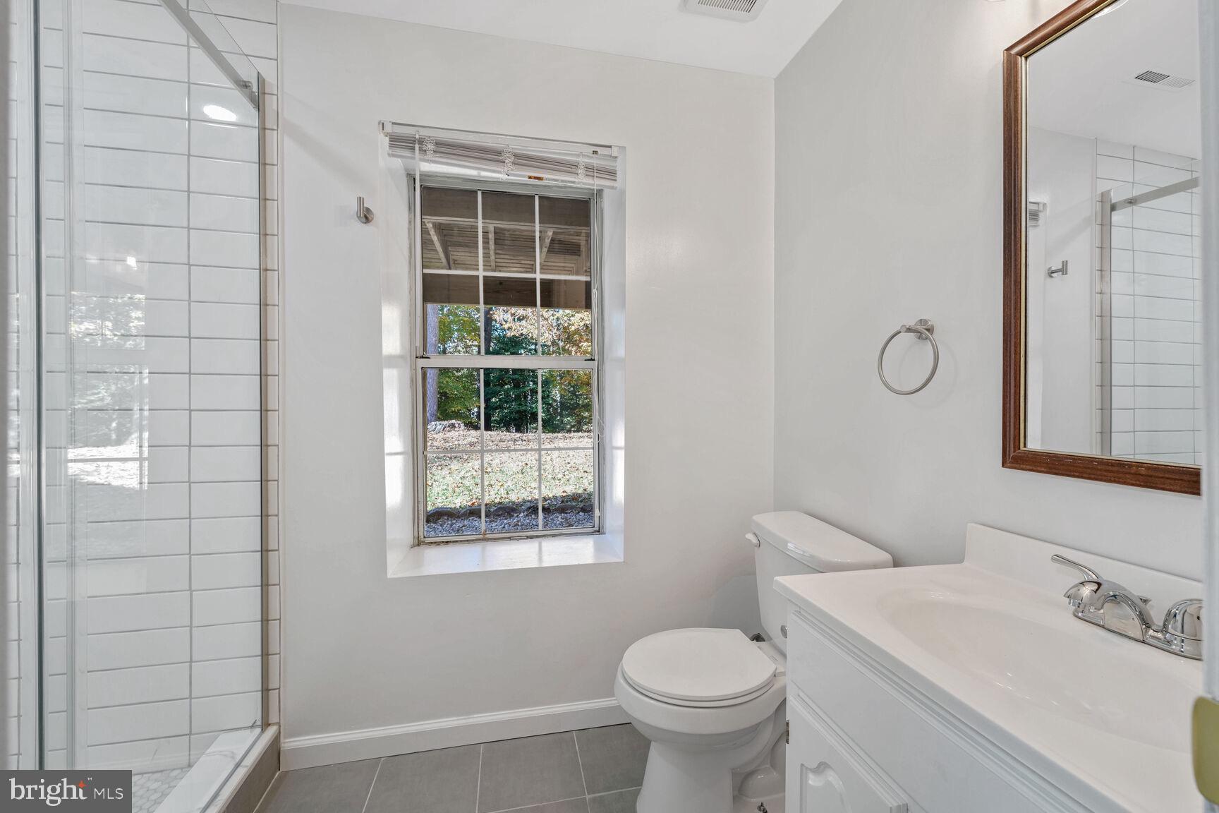 501 Dobbin Court Accokeek, MD 20607 - Photo 27 of 38 a bathroom with a sink toilet and shower