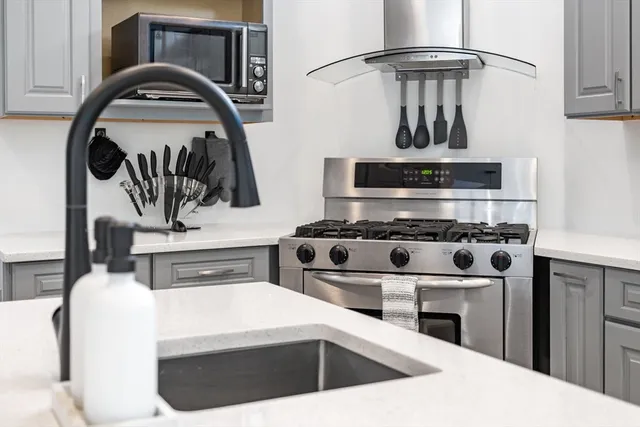 a kitchen with a stove and a sink
