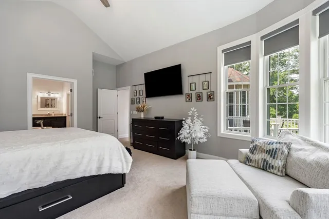 a bedroom with a bed and a flat screen television