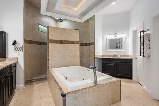 a bathroom with a bathtub and a sink