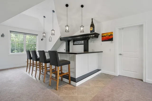 a view of a room with furniture and window