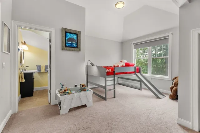 a bedroom with furniture and a window