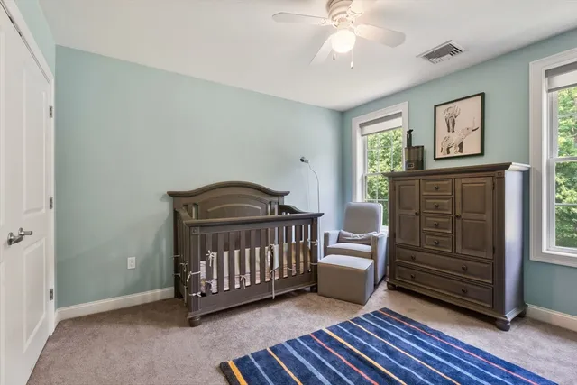 a bedroom with furniture and a window