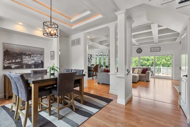 a living room with fireplace furniture and a large window