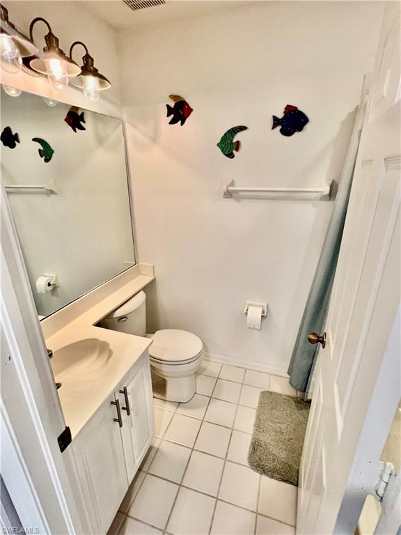 185 Gabriel Circle, Unit 4 Naples, FL 34104 - Photo 14 of 20 a bathroom with a sink a toilet and shower