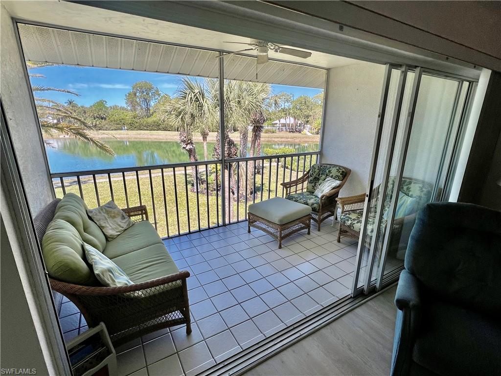 185 Gabriel Circle, Unit 4 Naples, FL 34104 - Photo 18 of 20 a outdoor living room with furniture and a window