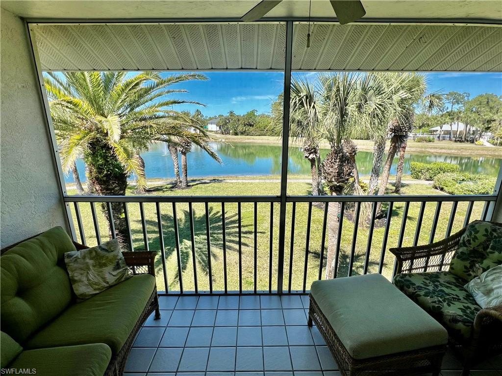 185 Gabriel Circle, Unit 4 Naples, FL 34104 - Photo 19 of 20 a view of a porch with furniture