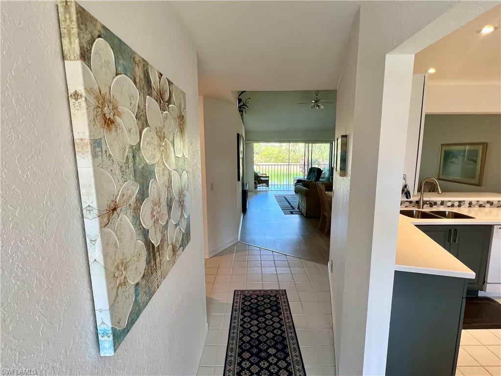 185 Gabriel Circle, Unit 4 Naples, FL 34104 - Photo 7 of 20 a bathroom with a sink and a shower