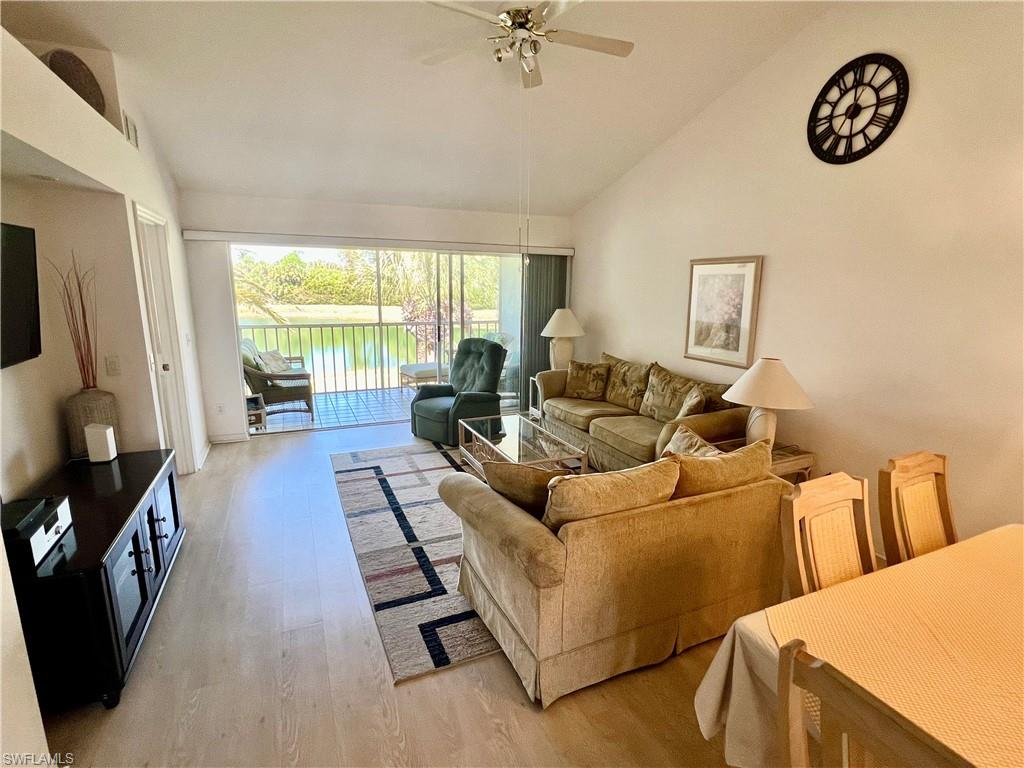 185 Gabriel Circle, Unit 4 Naples, FL 34104 - Photo 10 of 20 a living room with furniture and a flat screen tv