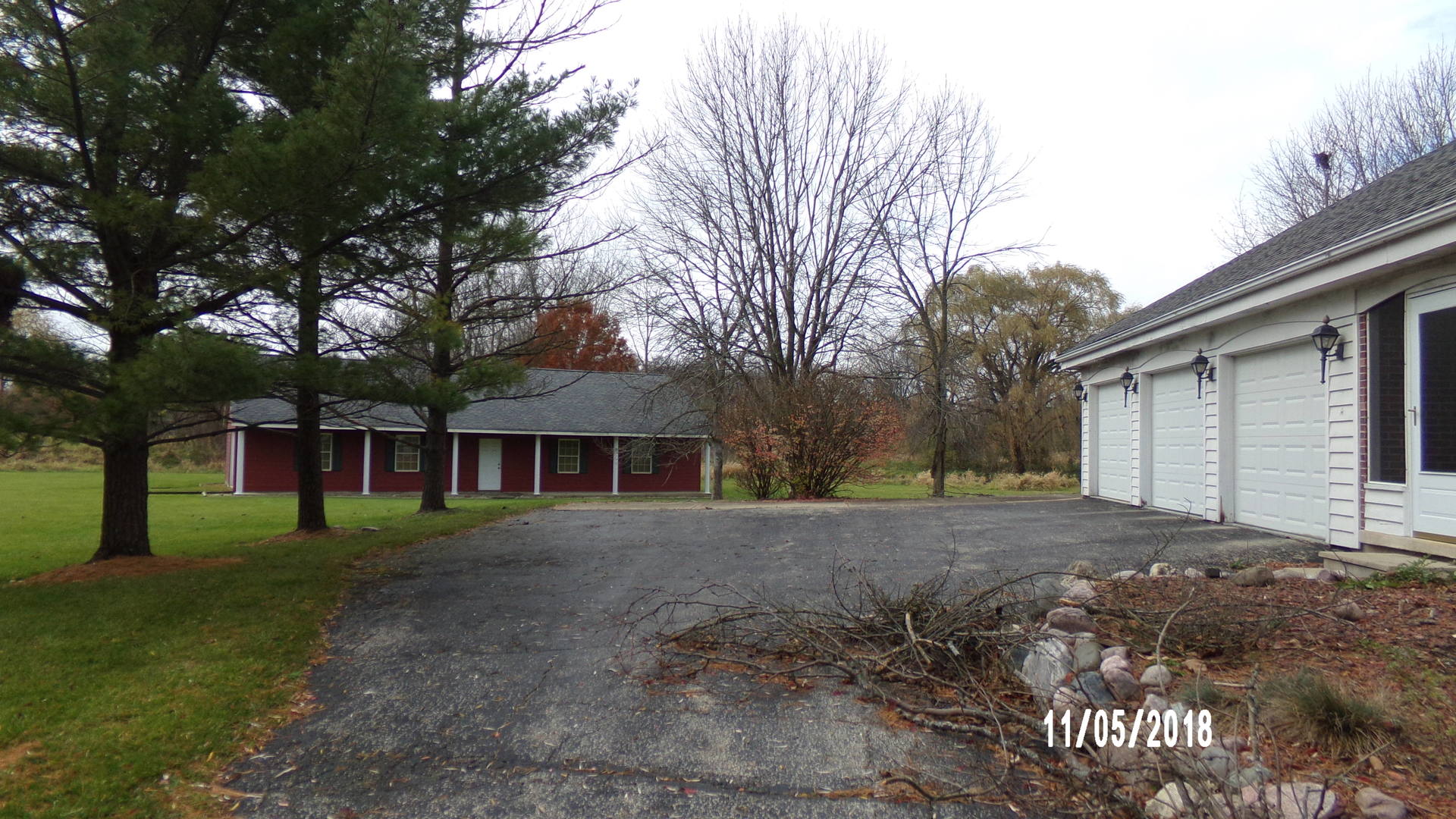 41 Spring Lane Barrington, IL 60010 - Photo 2 of 16 a view of a yard in front of a house with large trees