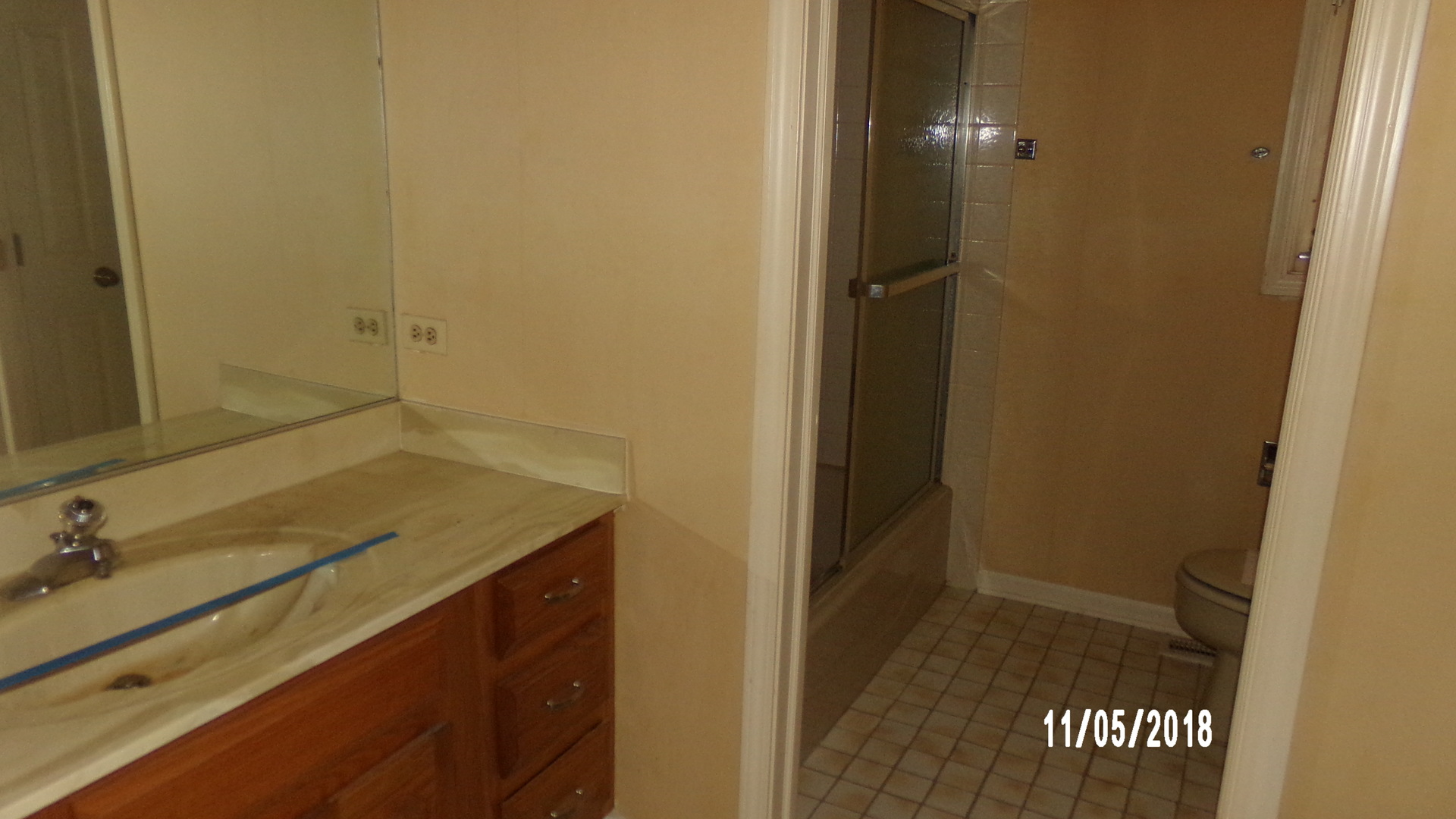 41 Spring Lane Barrington, IL 60010 - Photo 11 of 16 a bathroom with a granite countertop sink and a mirror