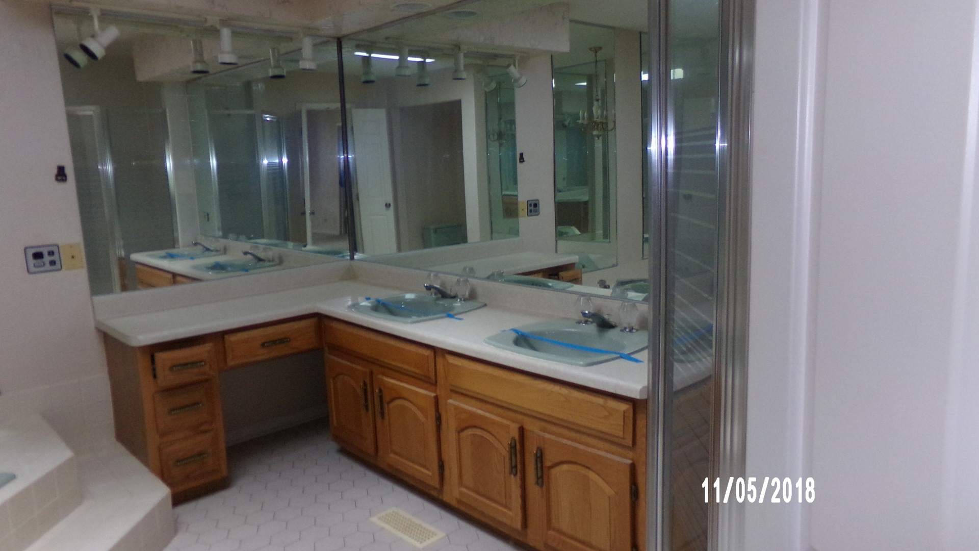 41 Spring Lane Barrington, IL 60010 - Photo 14 of 16 a bathroom with a granite countertop sink double vanity and a mirror