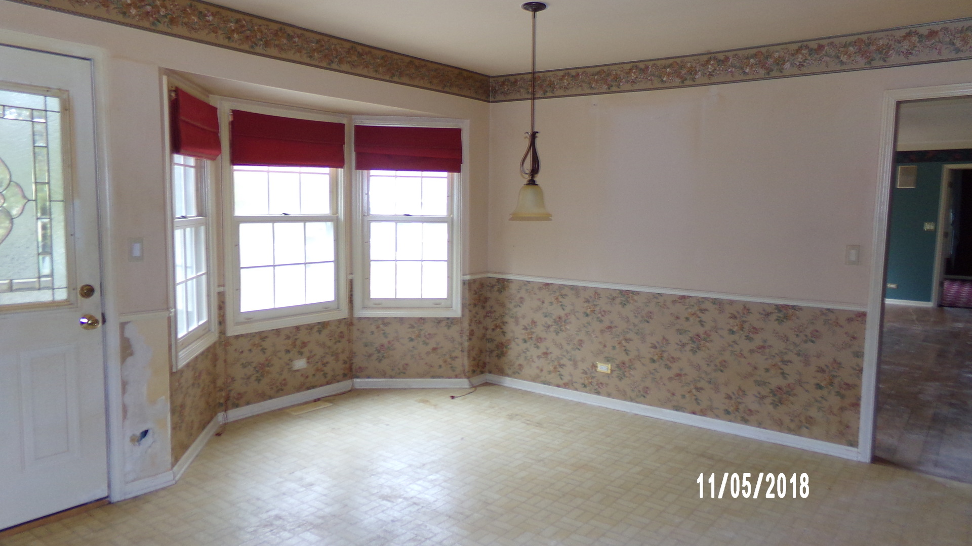 41 Spring Lane Barrington, IL 60010 - Photo 6 of 16 a view of empty room with window and chandelier fan