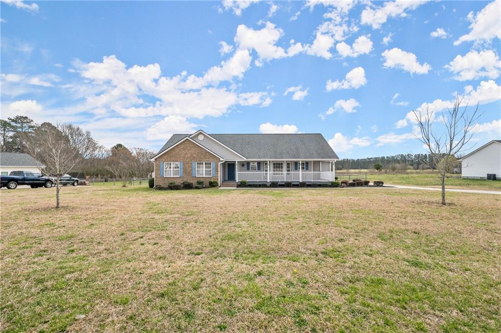 122 Queens Cemetery Road Good Hope, GA 30641 - Photo 1 of 1 a view of a house with a yard