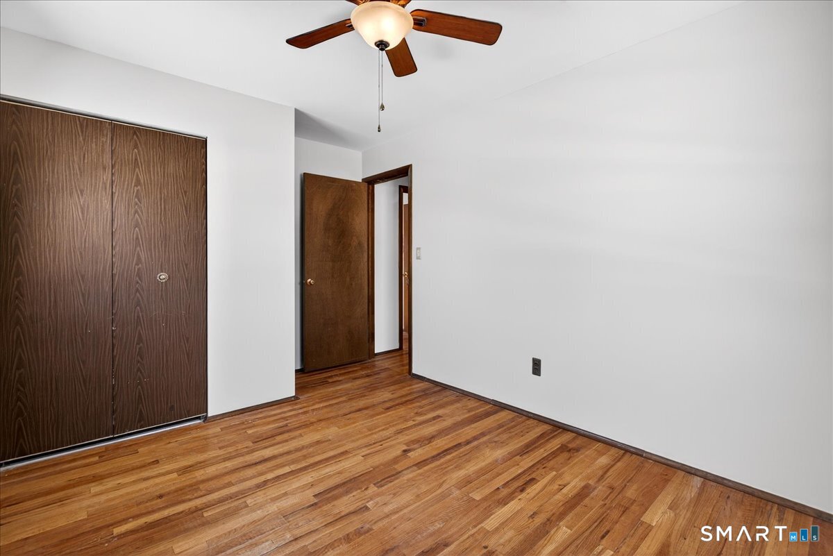 80 Flower Drive Hamden, CT 06518 - Photo 14 of 28 wooden floor in an empty room