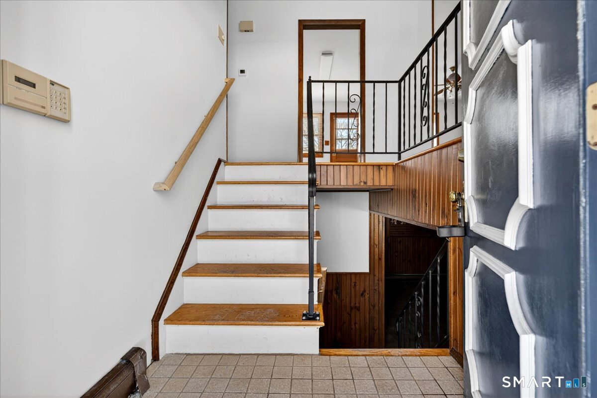 80 Flower Drive Hamden, CT 06518 - Photo 16 of 28 a view of entryway with wooden floor and stairs
