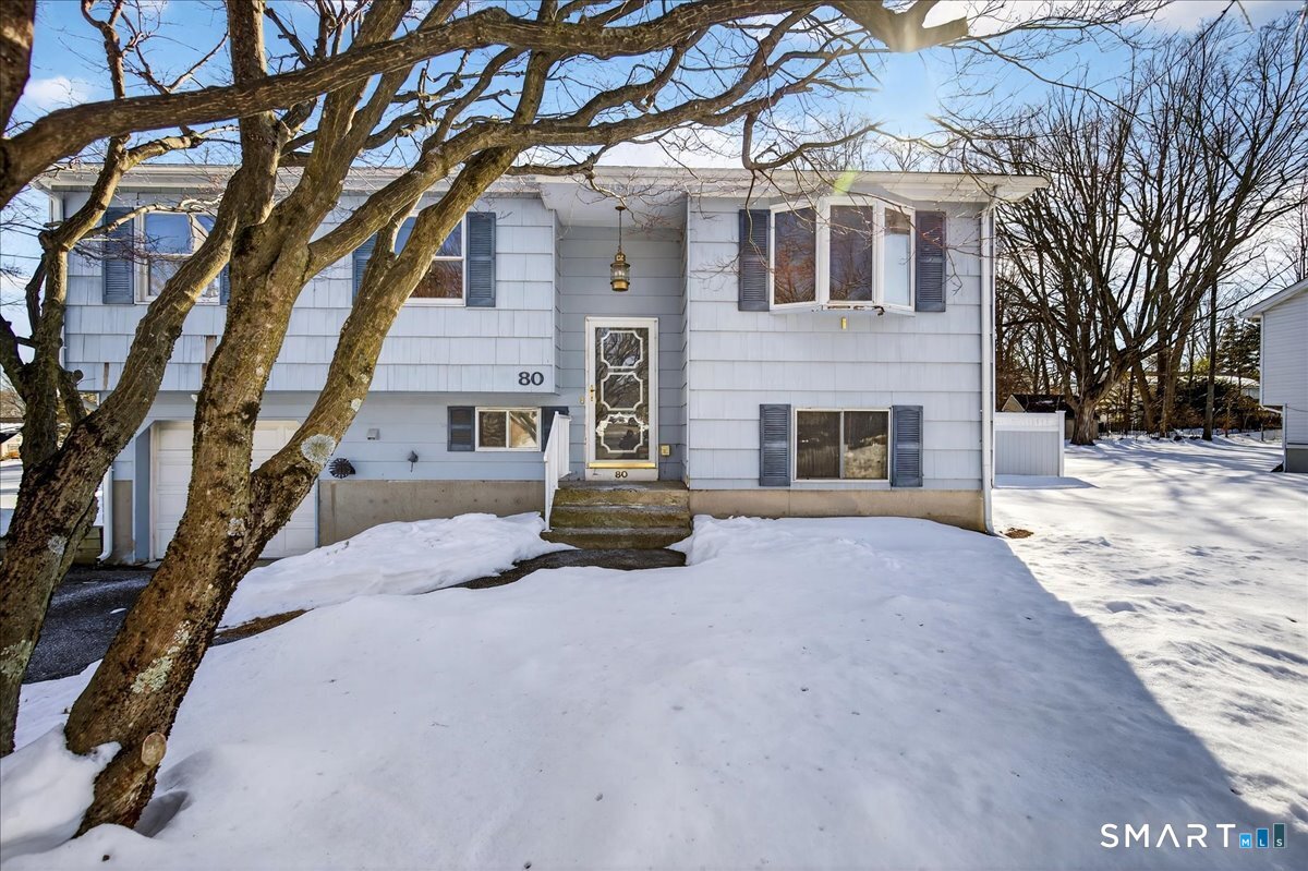 80 Flower Drive Hamden, CT 06518 - Photo 3 of 28 a front view of a house with a yard
