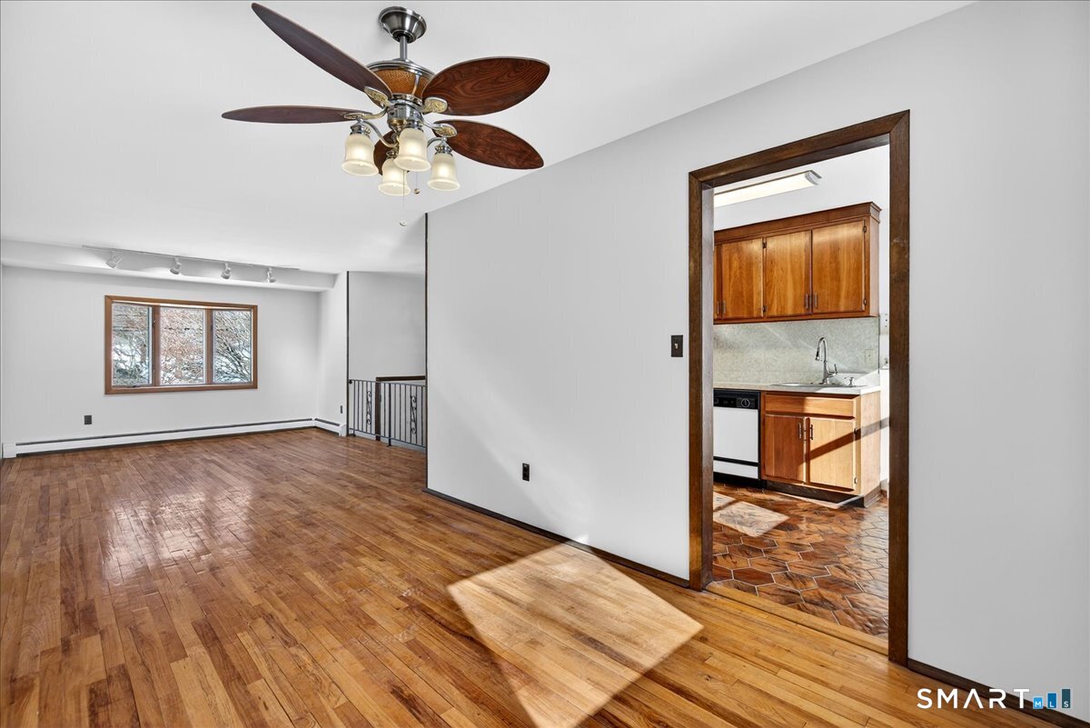 80 Flower Drive Hamden, CT 06518 - Photo 5 of 28 wooden floor in an empty room with a window