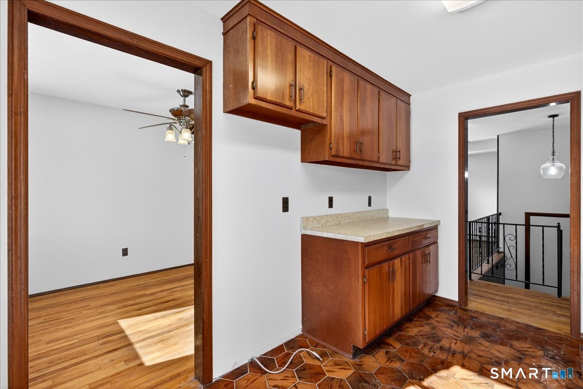 80 Flower Drive Hamden, CT 06518 - Photo 8 of 28 a kitchen with stainless steel appliances granite countertop a sink stove and refrigerator