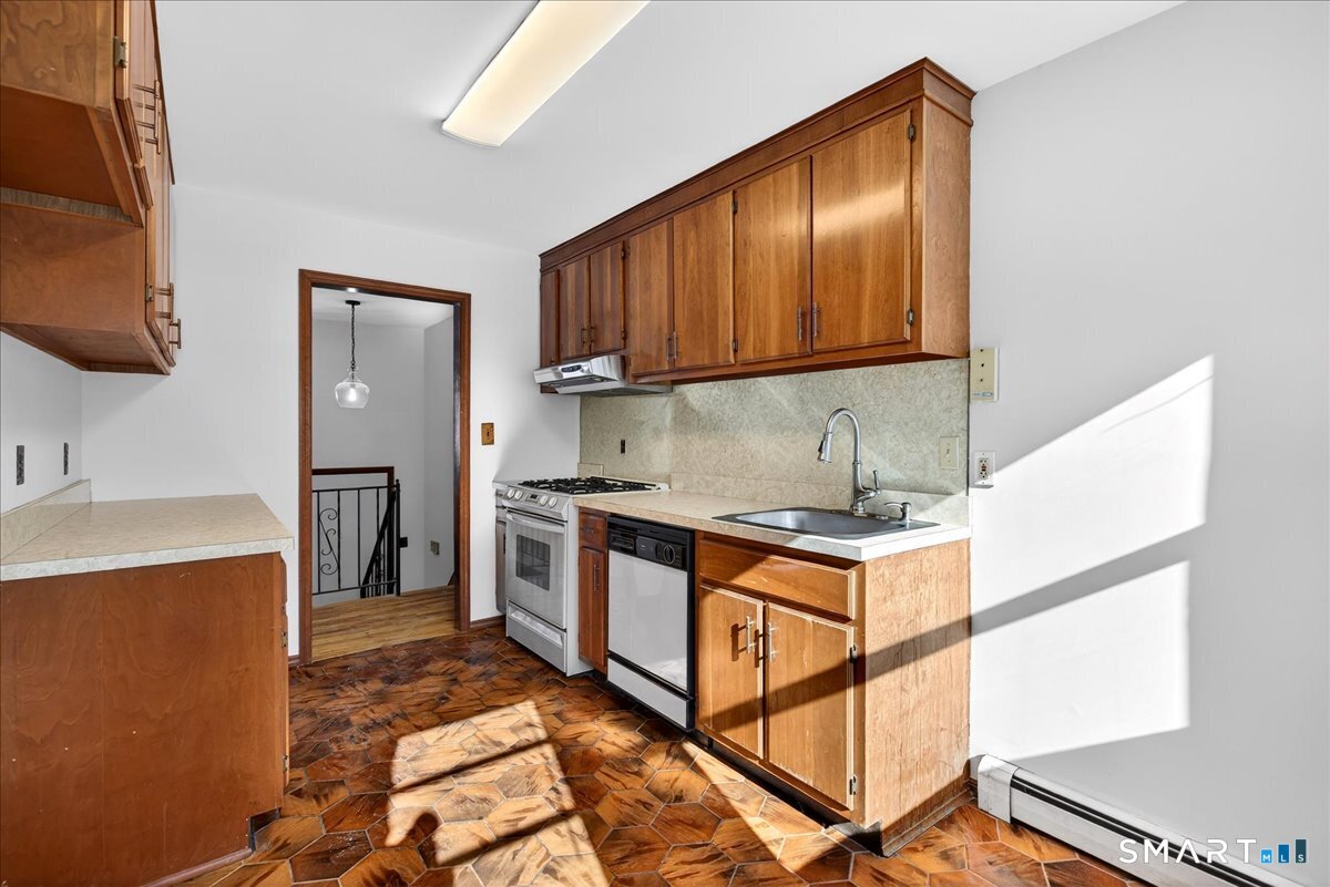 80 Flower Drive Hamden, CT 06518 - Photo 9 of 28 a kitchen with stainless steel appliances granite countertop a stove a sink and a refrigerator
