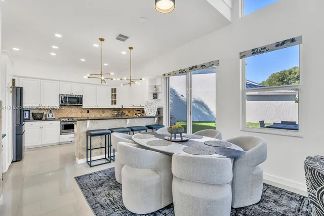 a view of living room with furniture and wooden floor