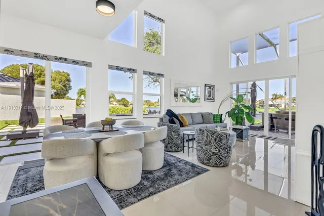 a view of a hallway with wooden floor and stairs