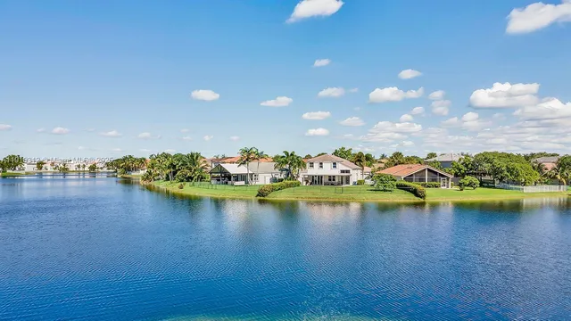 a view of a roof deck with furniture and a umbrella