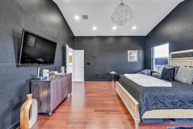 an aerial view of a house with a swimming pool