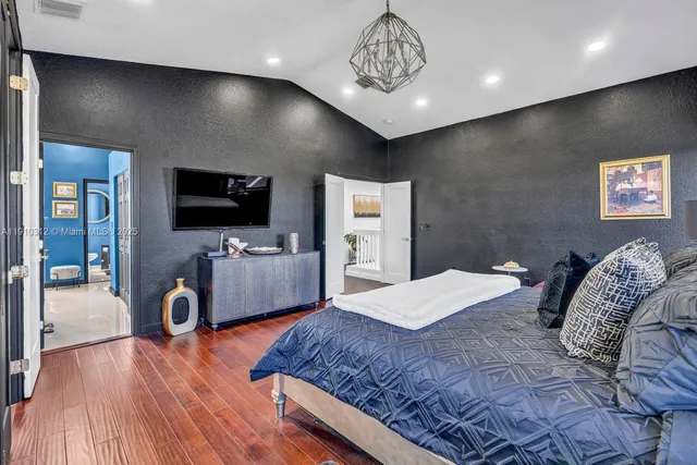 an aerial view of a house with a swimming pool