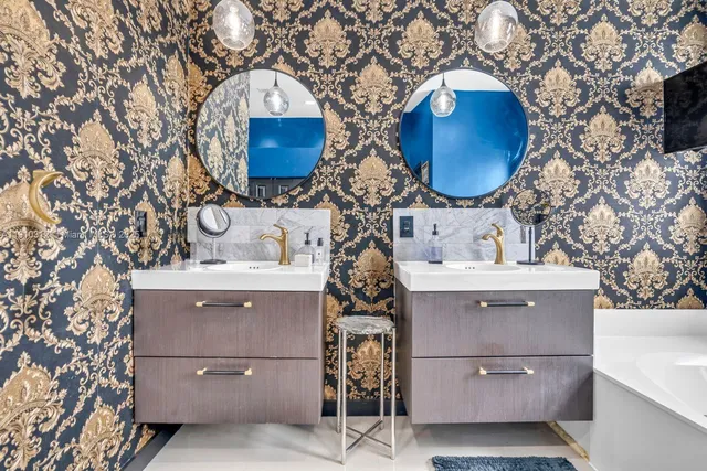 an aerial view of a house with a yard and lake view