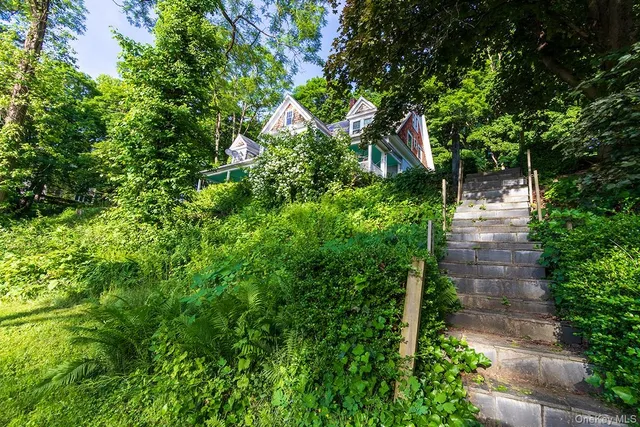 a backyard of a house with lots of green space