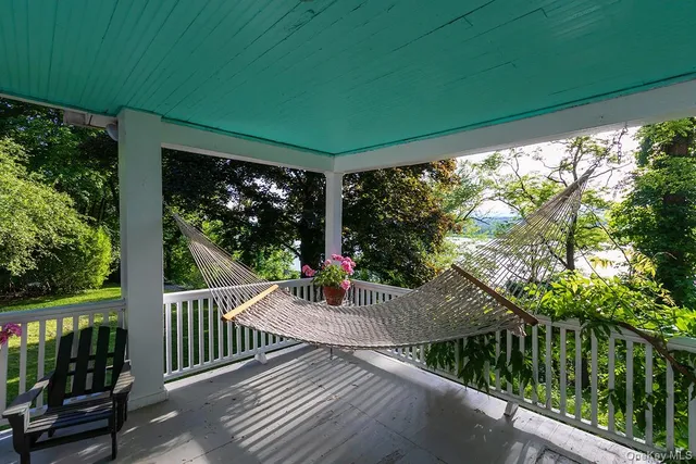 a view of a porch with wooden floor and outdoor space