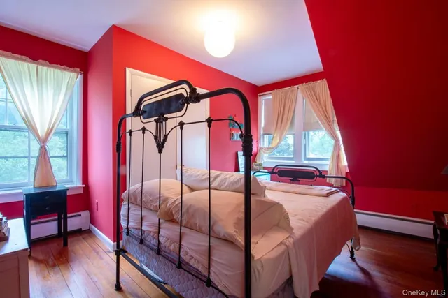 a bed room with a bed and a window