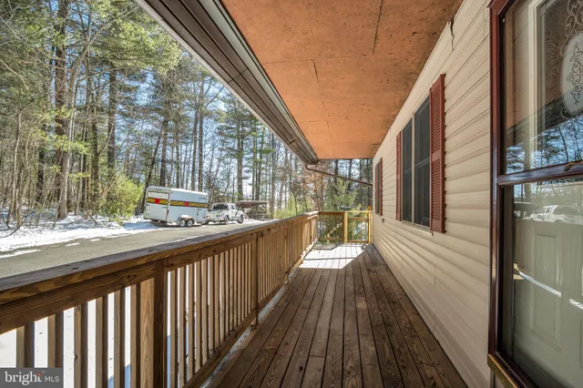 a view of balcony with wooden floor