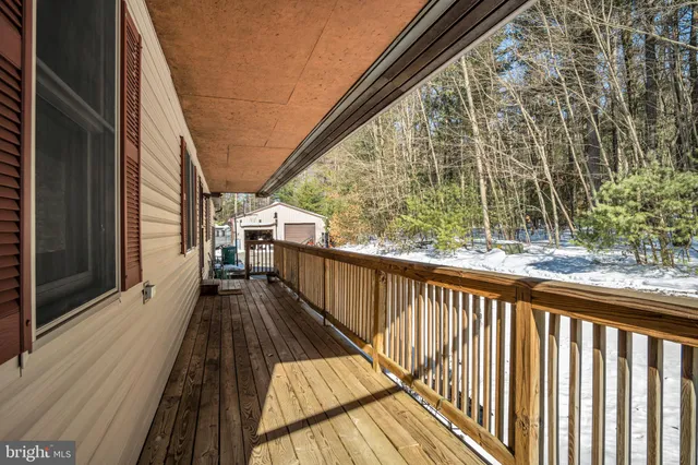 a view of balcony with wooden floor