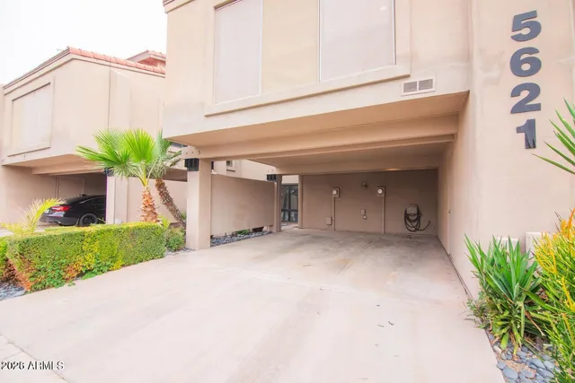a view of a house with a yard and garage