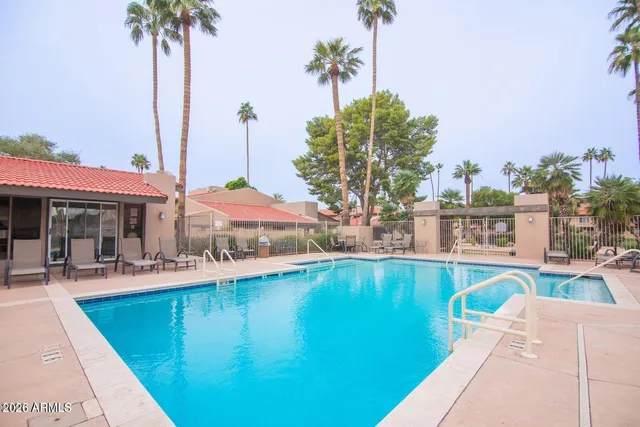 a view of a swimming pool with a lounge chairs