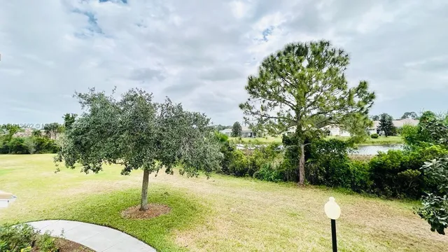 a backyard of a house with lots of green space