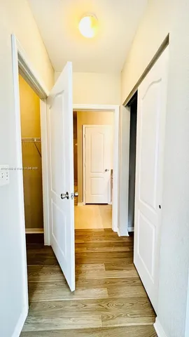 a view of a bathroom with wooden floor