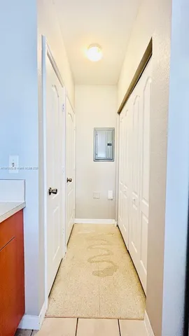 a view of a hallway with a bathroom