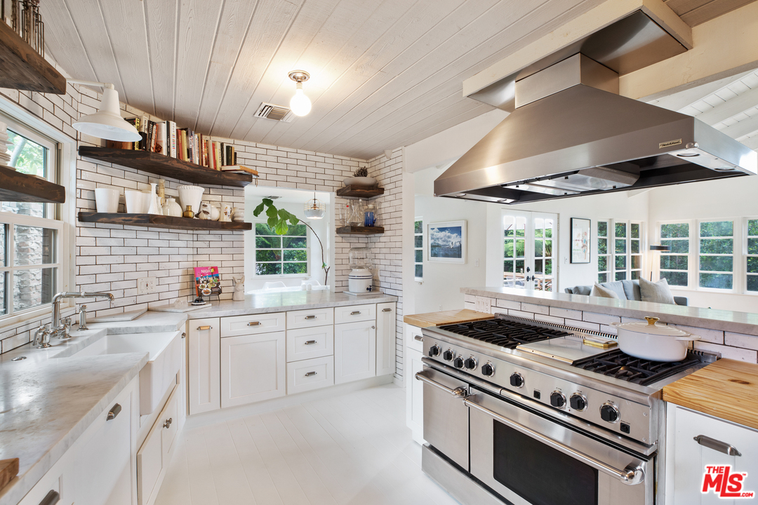 558 East Channel Road Santa Monica, CA 90402 - Photo 13 of 34 a kitchen with a stove and a sink