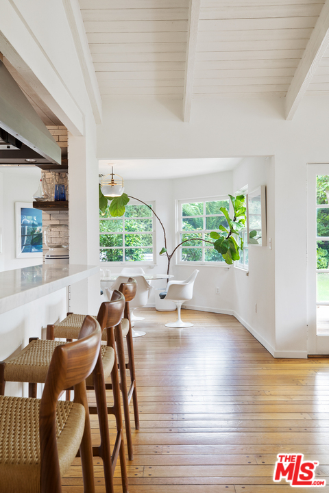 558 East Channel Road Santa Monica, CA 90402 - Photo 15 of 34 a view of a dining room with furniture and a large window