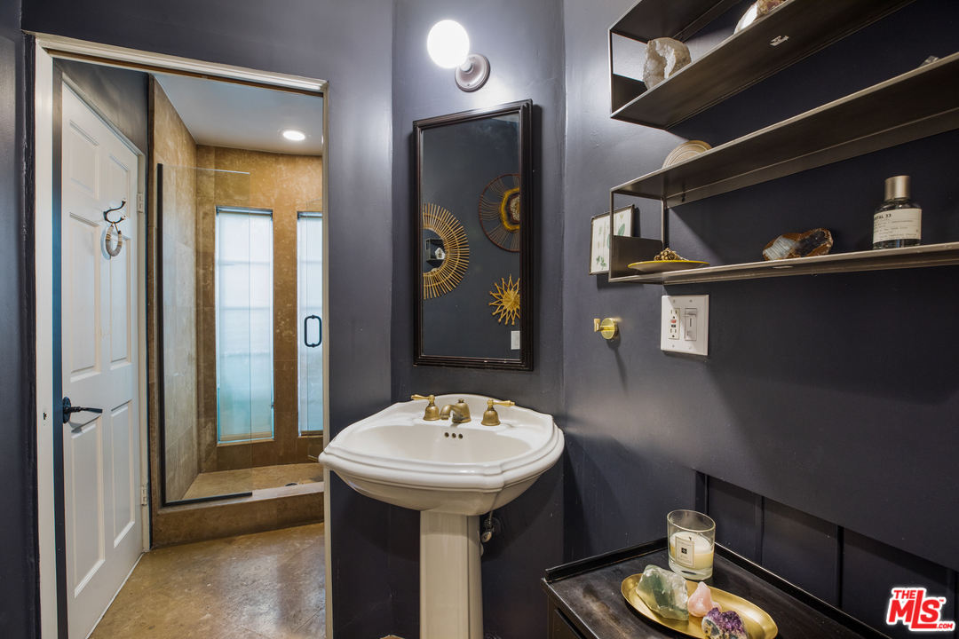 558 East Channel Road Santa Monica, CA 90402 - Photo 17 of 34 a bathroom with a sink and a mirror