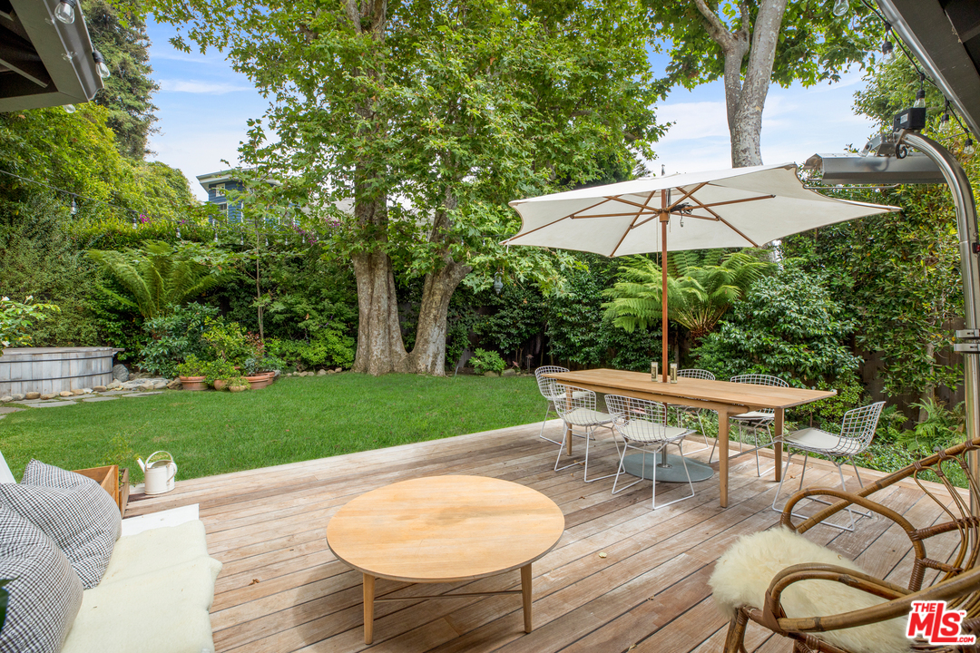 558 East Channel Road Santa Monica, CA 90402 - Photo 29 of 34 a view of a table and chairs under an umbrella