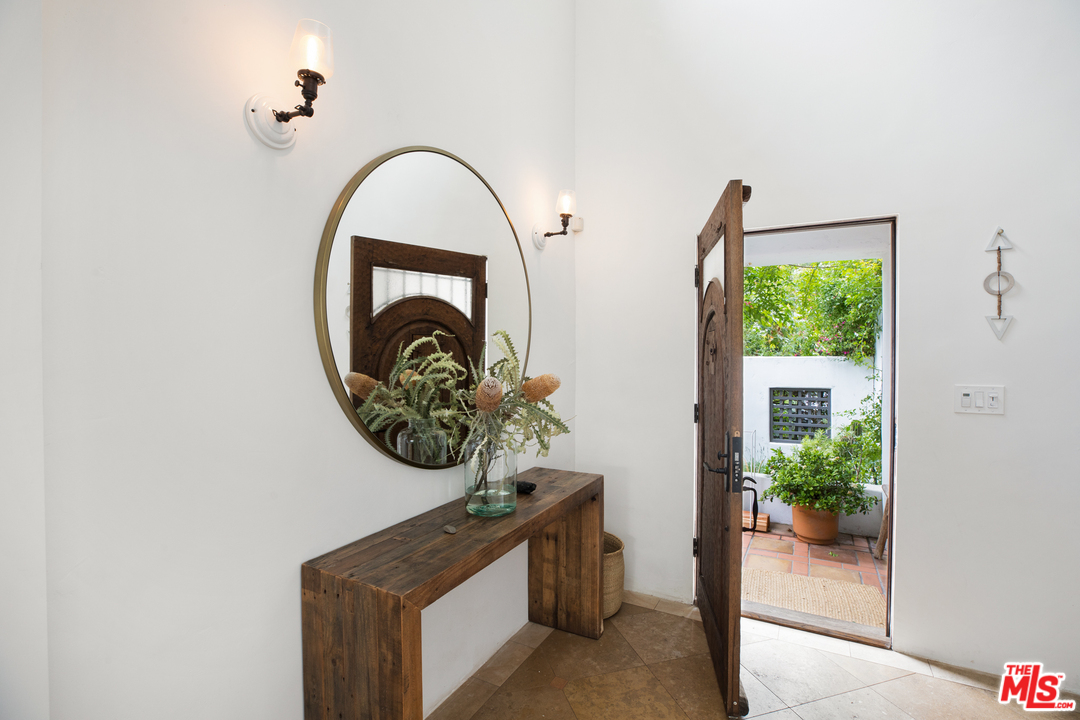 558 East Channel Road Santa Monica, CA 90402 - Photo 7 of 34 a front view of a house with garden