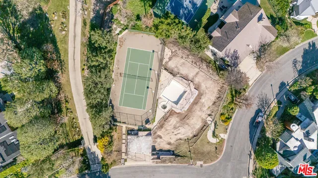 an aerial view of a house with a garden
